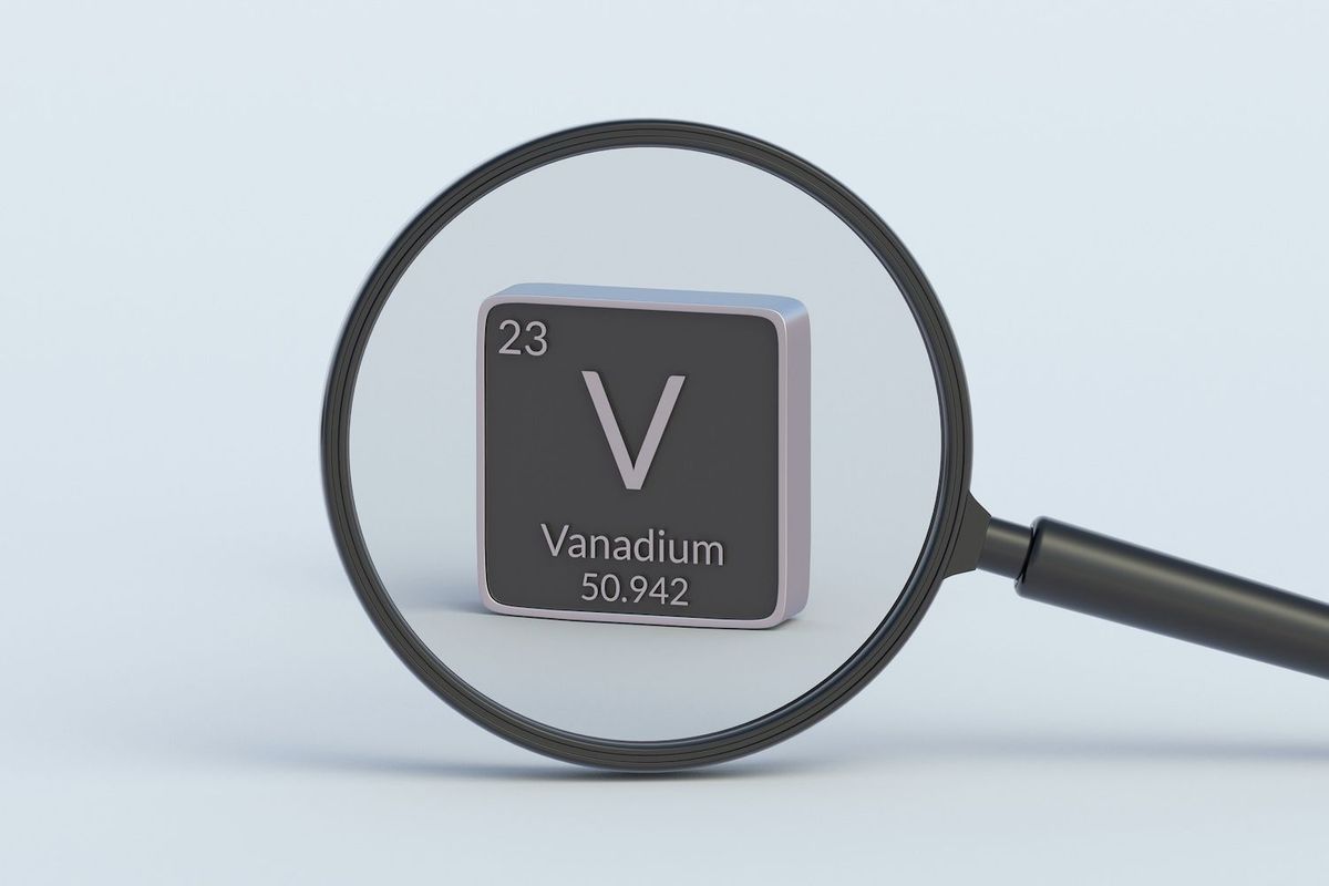 Magnifying glass looking at vanadium periodic symbol.